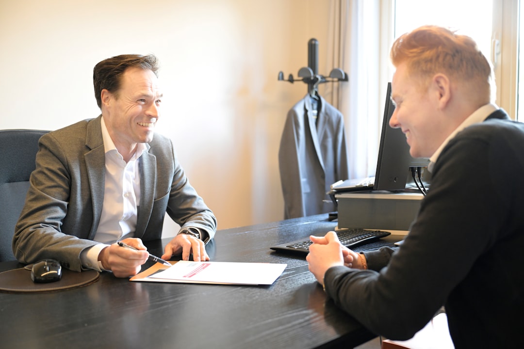 Solicitor explaining ground rent thresholds to a flat buyer