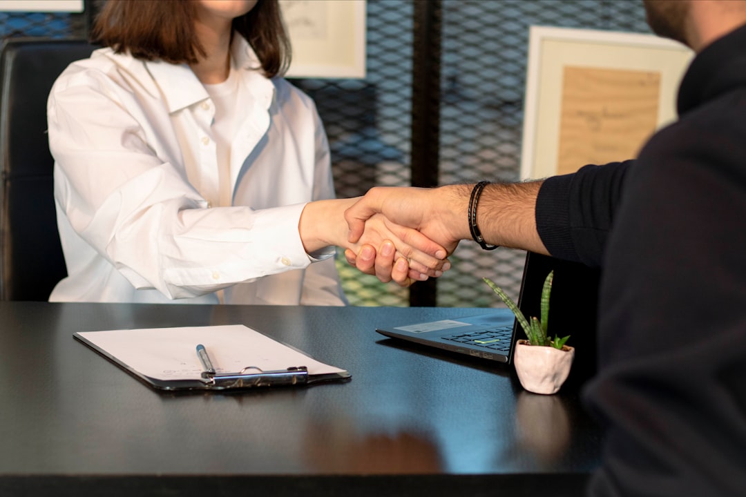 A first-time buyer preparing for a mortgage broker meeting with documents organised on a desk