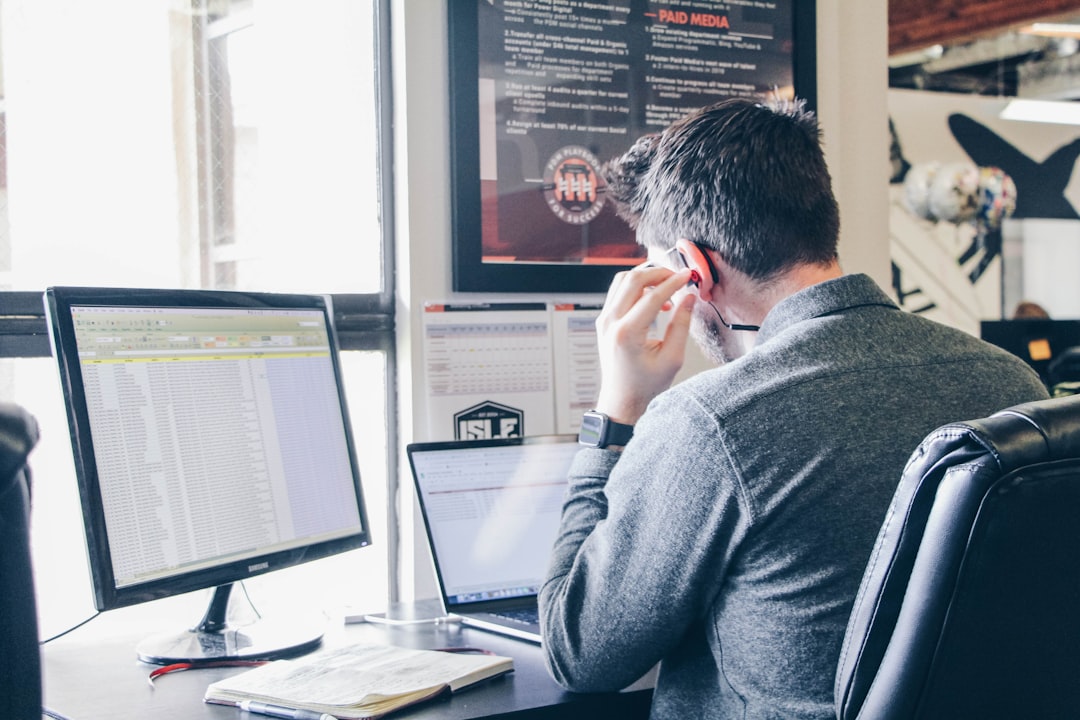 A buyer pausing to verify AI answers about buying a house against official sources