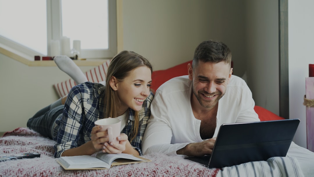 A couple calmly working through their house survey report together at home