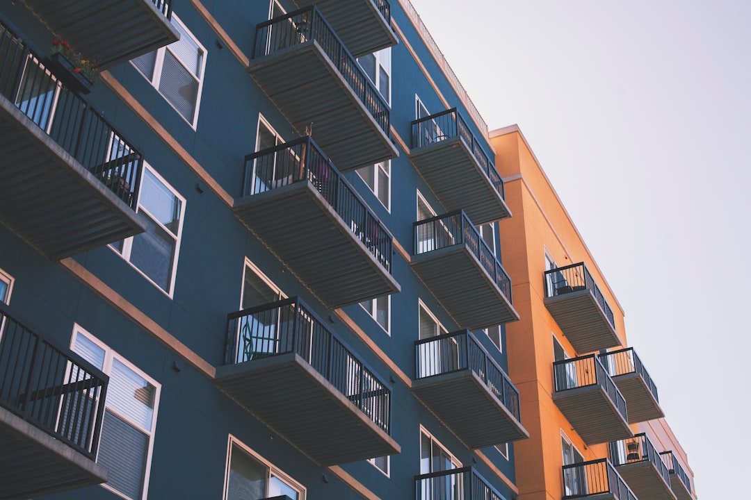 Buyer asking an estate agent about the leasehold management pack for a flat purchase