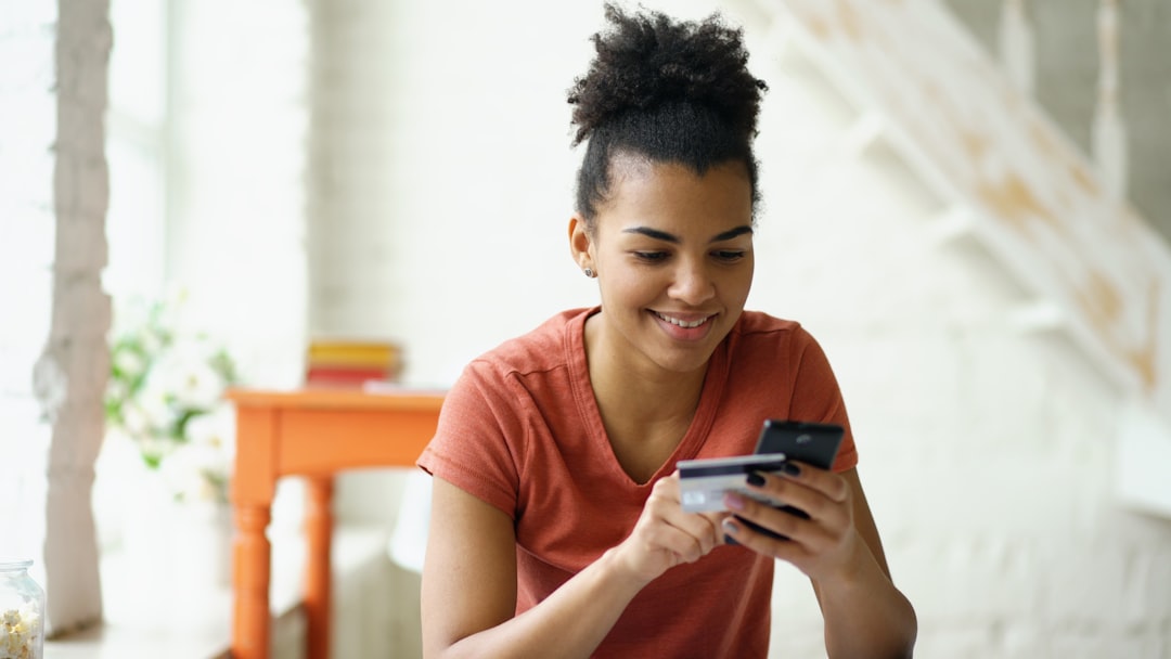 First-time buyer opening a Lifetime ISA savings account on her phone