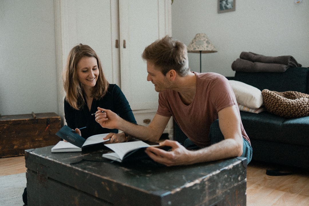 Couple working through a home-buying planner app and checklist together