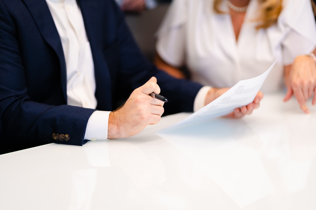 Couple preparing payslips and bank statements for their full mortgage application after offer acceptance