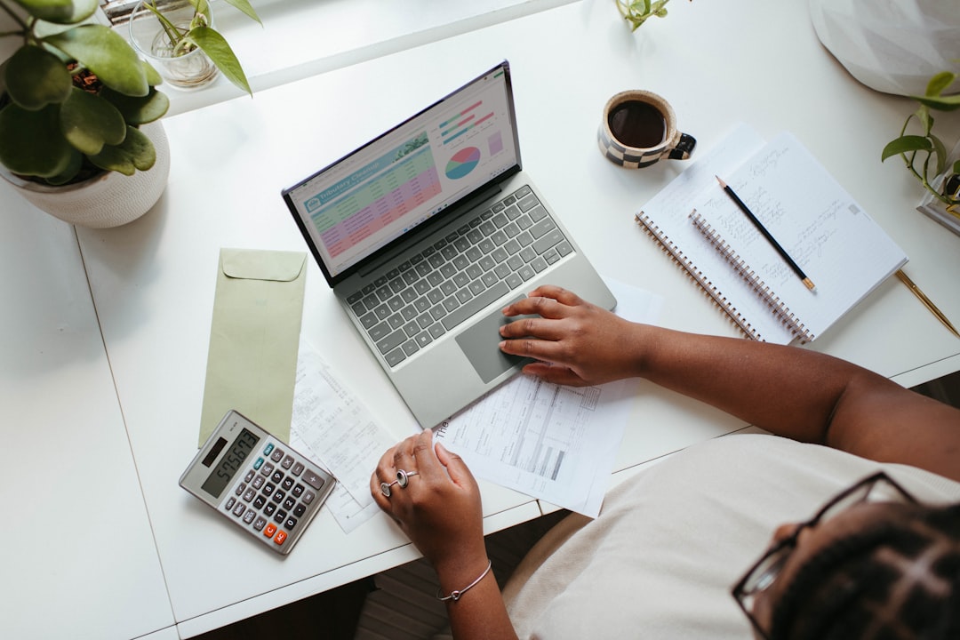 A buyer checking ground rent figures in a lease on her laptop