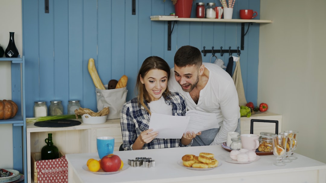 A couple reviewing service charge accounts for a Manchester flat