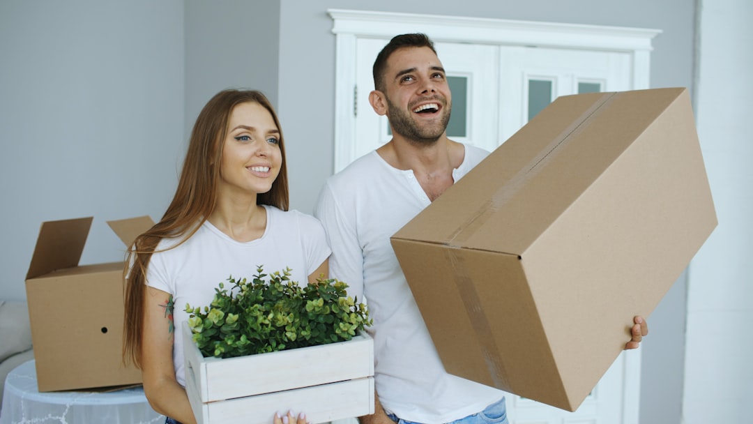 A couple receiving keys to a Manchester flat after completing their checks